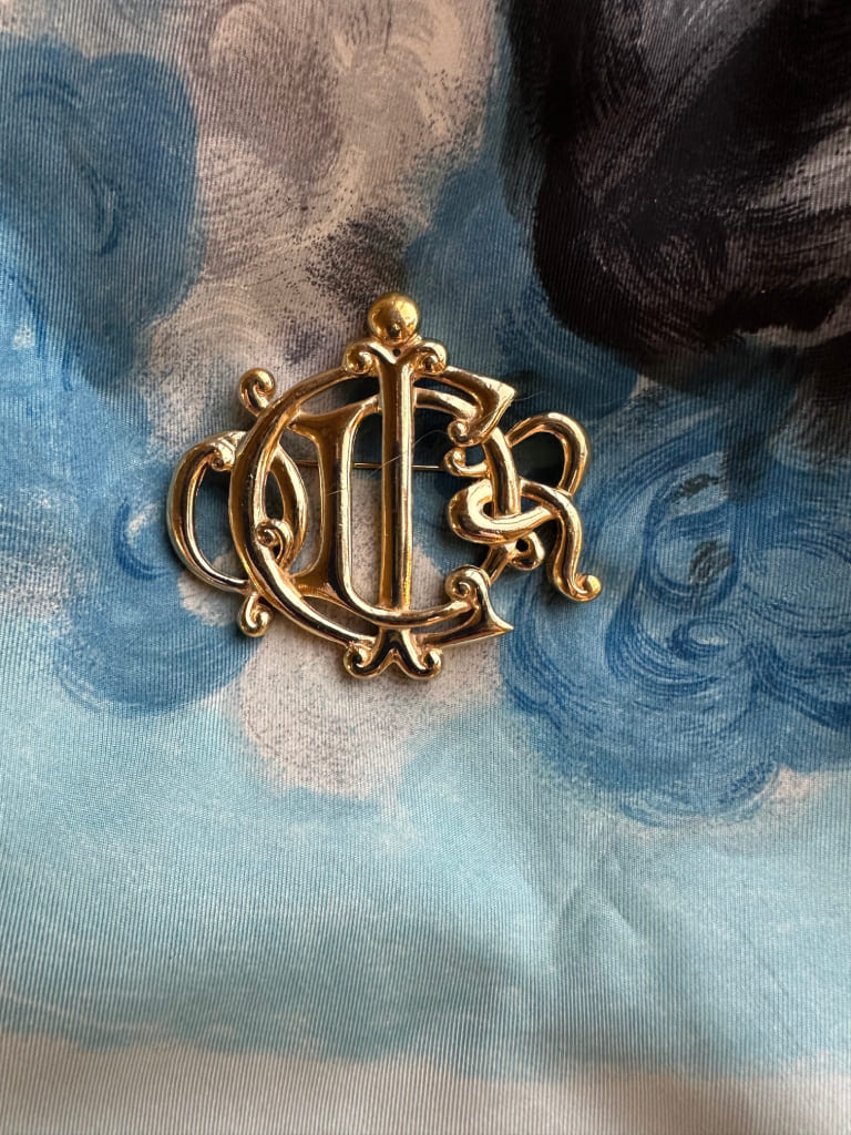 Brooch - logo from the Fashion House Christian Dior