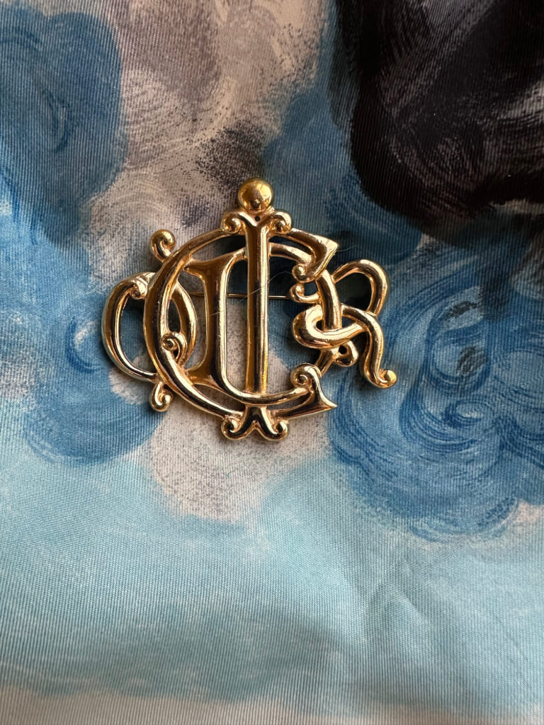 Brooch - logo from the Fashion House Christian Dior